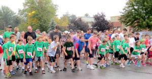 Zionsville hit the bricks 5k runners line up to start to keep their bodies moving