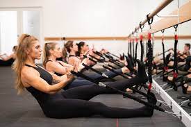 Women staying activethrough barre techniques at pure barre in Zionsville.